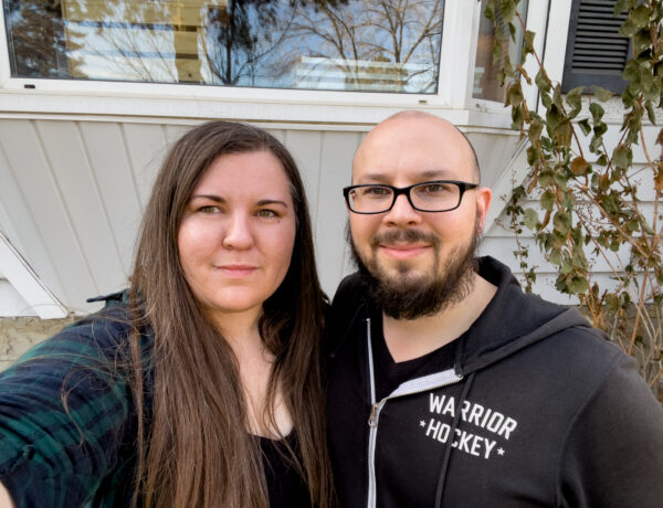 Tracey and Josh standing in front of their new house
